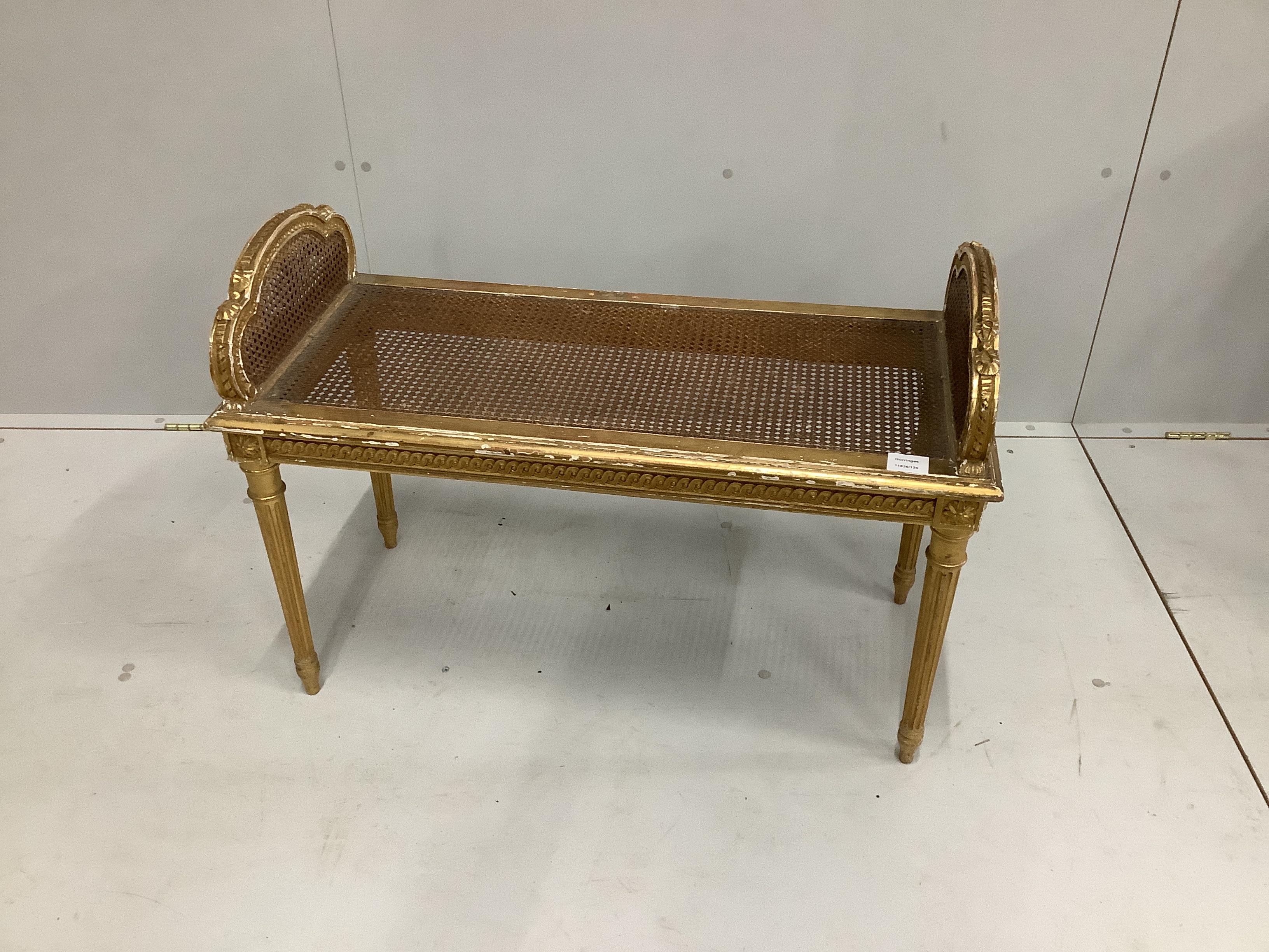 A Victorian carved giltwood and composition caned window seat, width 85cm, depth 38cm, height 60cm